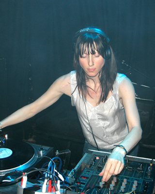 Ellen Allien mixing vinyl in the booth at ADE